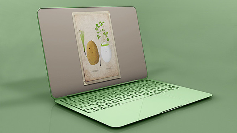Auf dem Bildschirm eines grünen Laptops ist eine Illustration einer Kartoffel zu sehen.